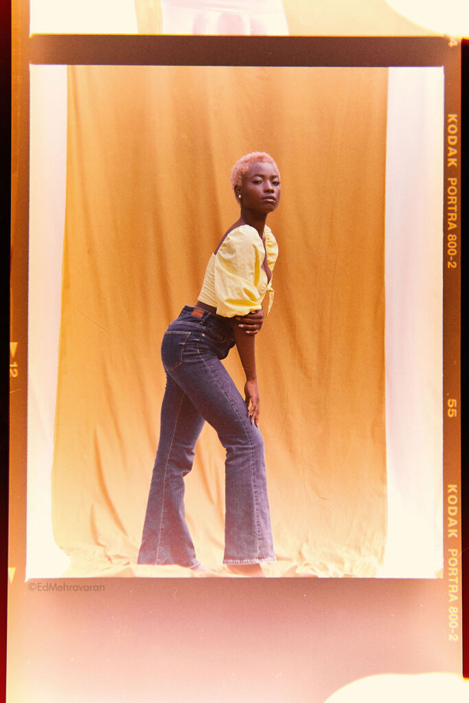 Marie wearing yellow shirt and Jeans