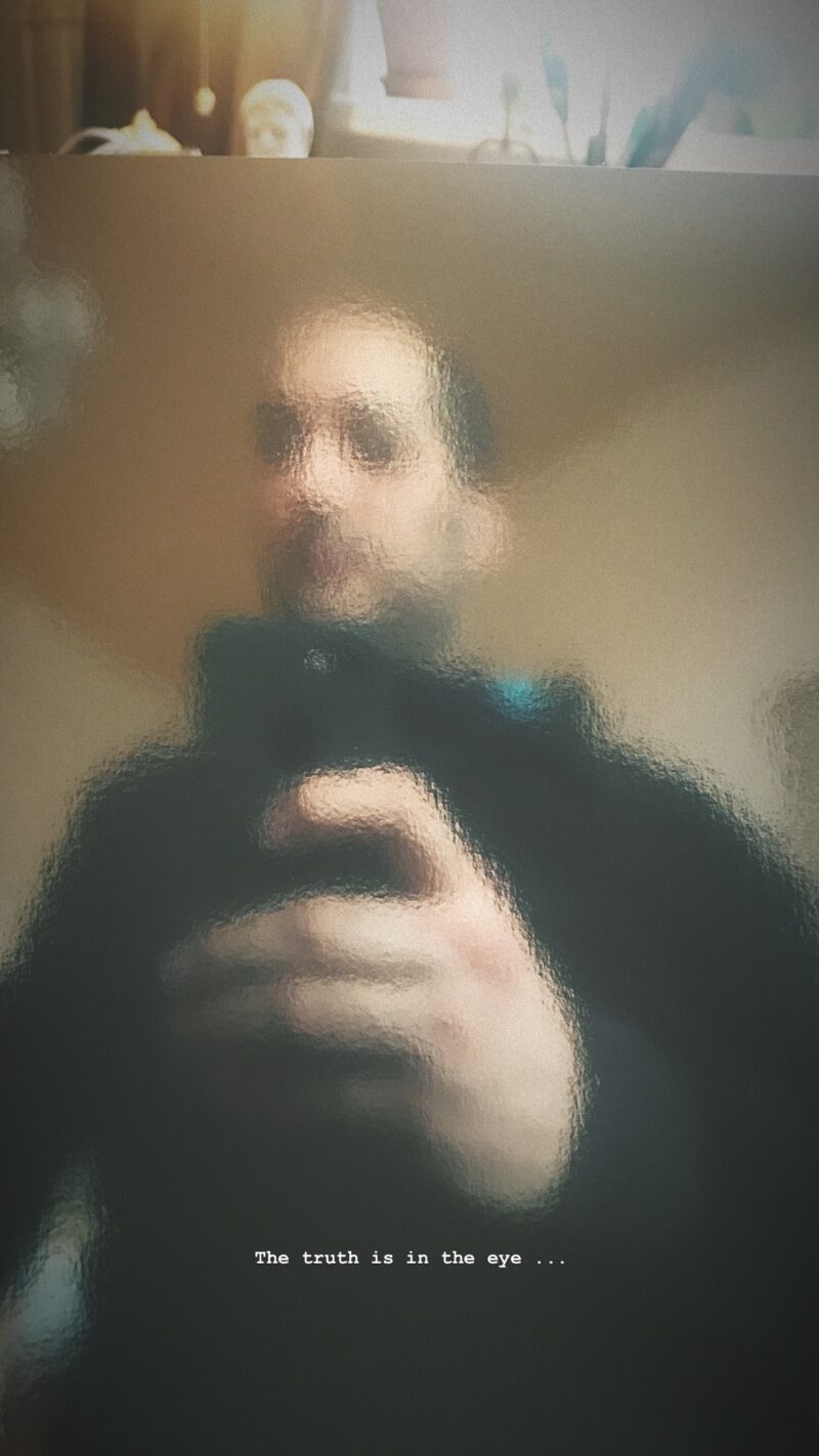 The truth is in the eye. My self portrait from my reflection from the silver book cover