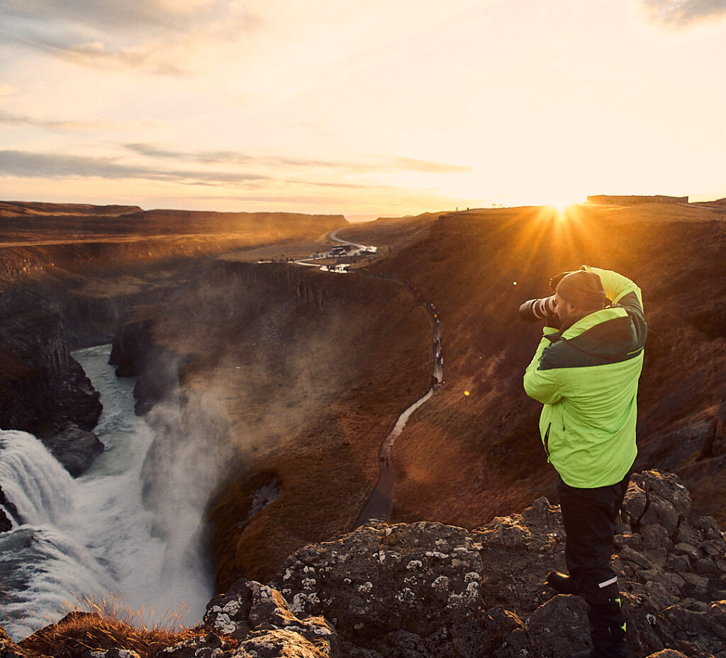 Ed Mehravaran Taking a photo in front of the waterfall