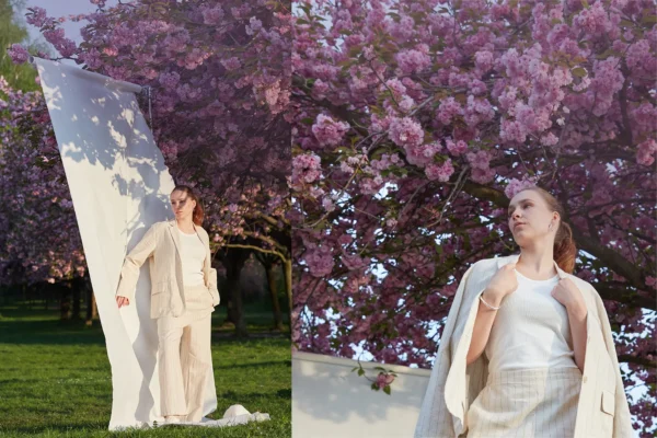 A female model standing in front of the cherry Blooms in BERLIN