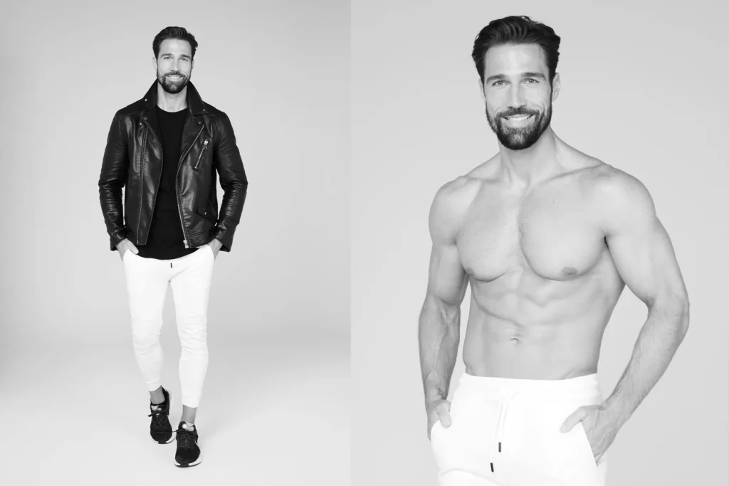 Black and white professional modeling portfolio photos featuring a bearded male model in two distinct looks - a casual styled shot wearing a black leather jacket with white pants and sneakers on the left, and a fitness-focused shirtless portrait showcasing athletic physique on the right, both shot against clean neutral backgrounds for Berlin sedcard photography