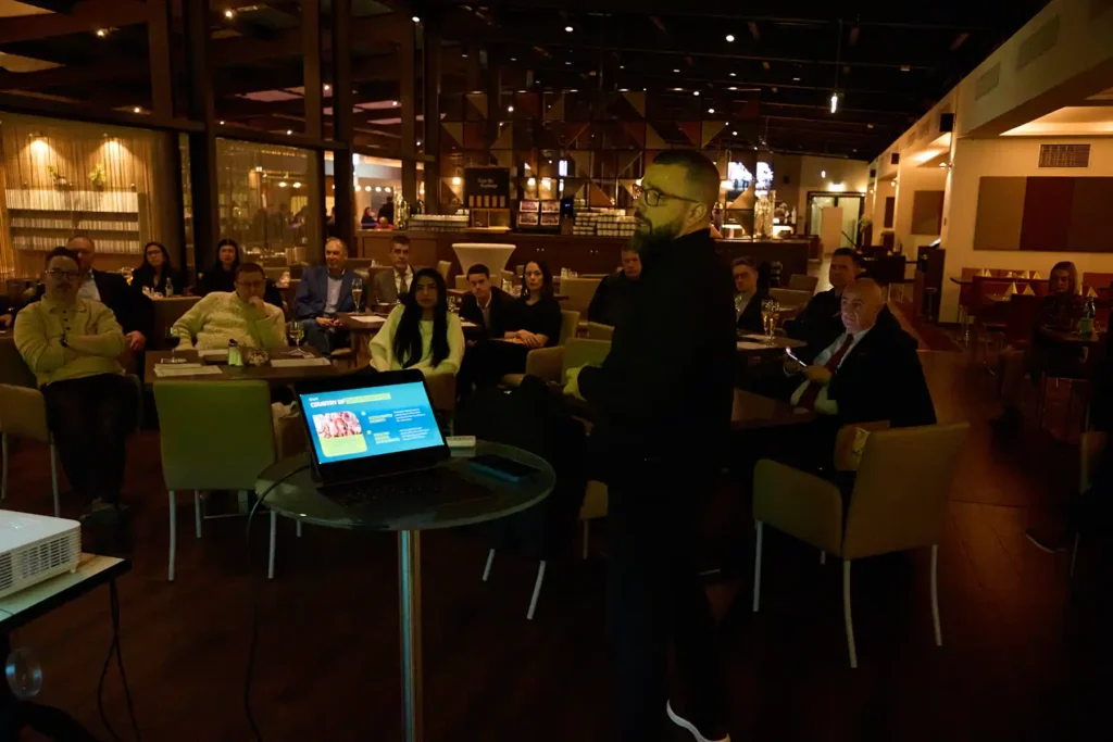 ِEvent photos from a man giving a presentation in Berlin Park Inn Hotels