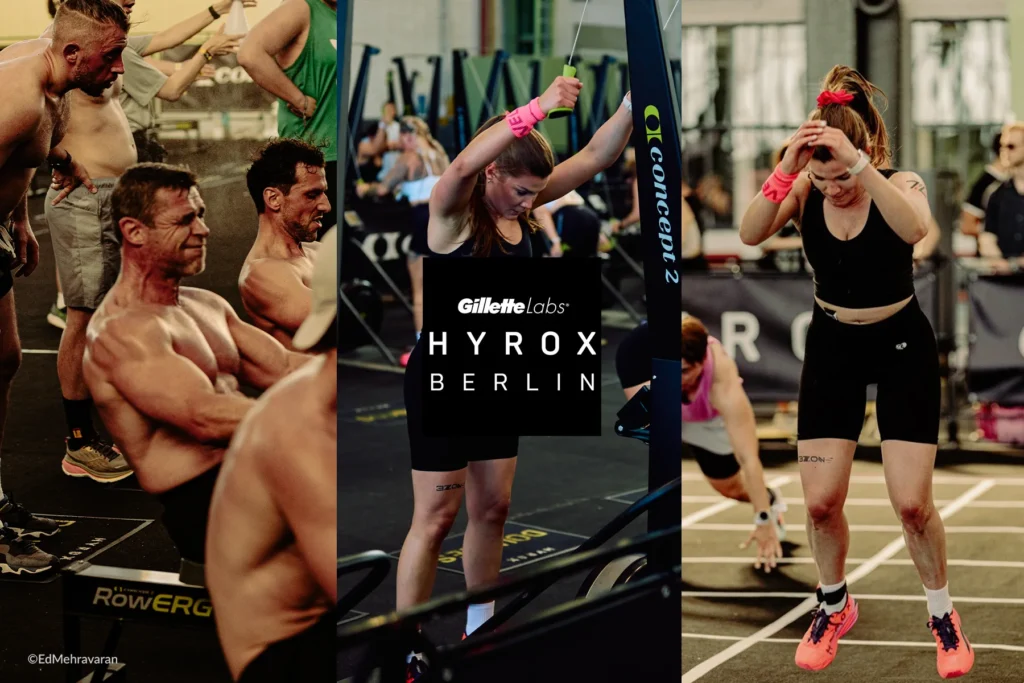 Eine dreiteilige Fotocollage vom HYROX Berlin, präsentiert von Gillette Labs. Links: Athleten mit freiem Oberkörper sitzen verschwitzt und konzentriert an Rudergeräten; im Hintergrund sind Zuschauer zu sehen. Mitte: Eine Frau mit langem Haar und rosa Handgelenksbandagen zieht bei einer Übung am Ski-Ergometer oder Kabelzug ein Widerstandskabel über den Kopf; die Logos von HYROX BERLIN und Gillette Labs sind als weißer Schriftzug auf einem schwarzen Quadrat eingeblendet. Rechts: Eine Frau mit roter Haarschleife und rosa Armbändern läuft auf einer markierten Bahn; sie trägt schwarze Sportkleidung sowie korallenfarbene Laufschuhe und hält sich vor Anstrengung die Hände an den Kopf. Foto: ©Ed Mehravaran.